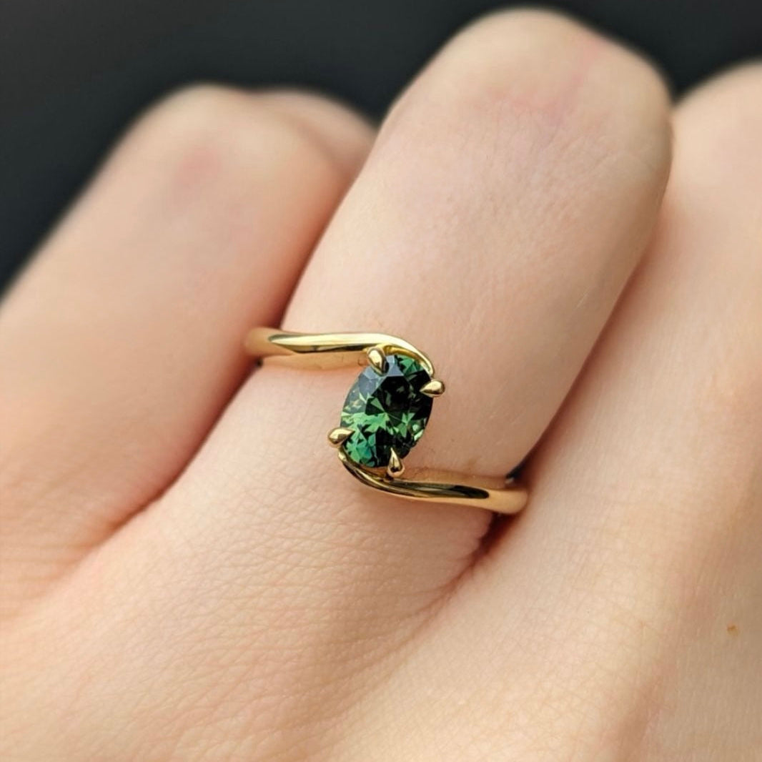 bypass ring with oval shaped Emerald
