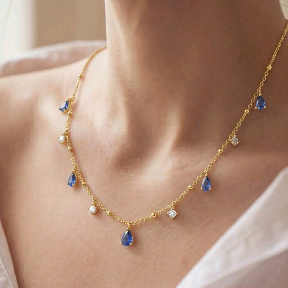 Necklace with pear shaped shapphires and round diamonds