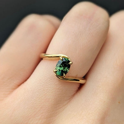 bypass ring with oval shaped Emerald
