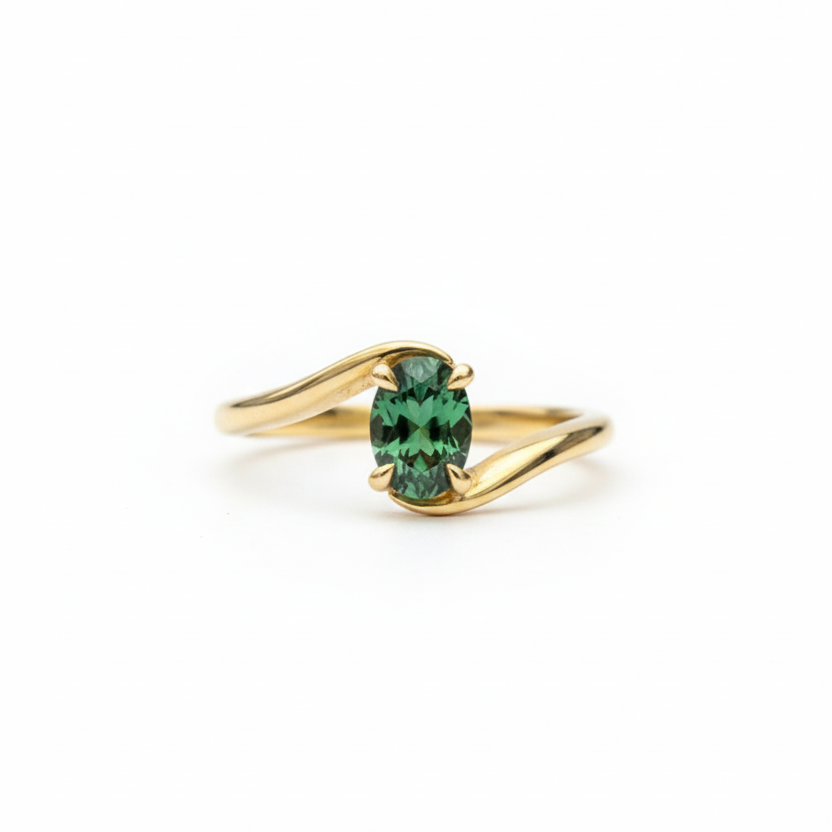 bypass ring with oval shaped Emerald