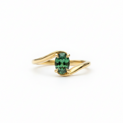 bypass ring with oval shaped Emerald