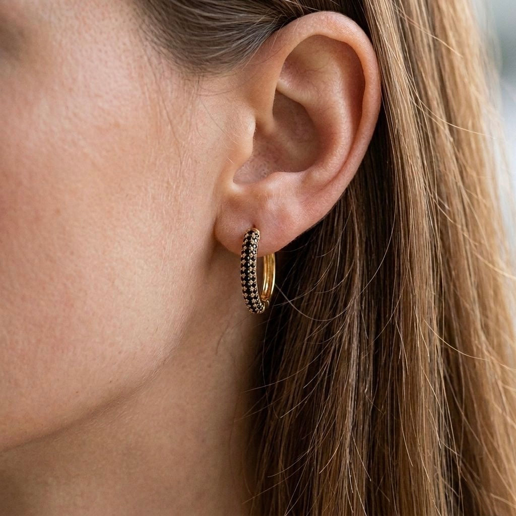 Huggie earrings with black diamonds