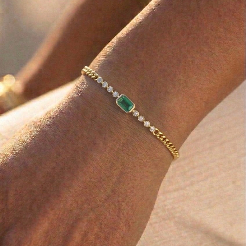 Curb chain with emerald-cut Emerald and Diamonds